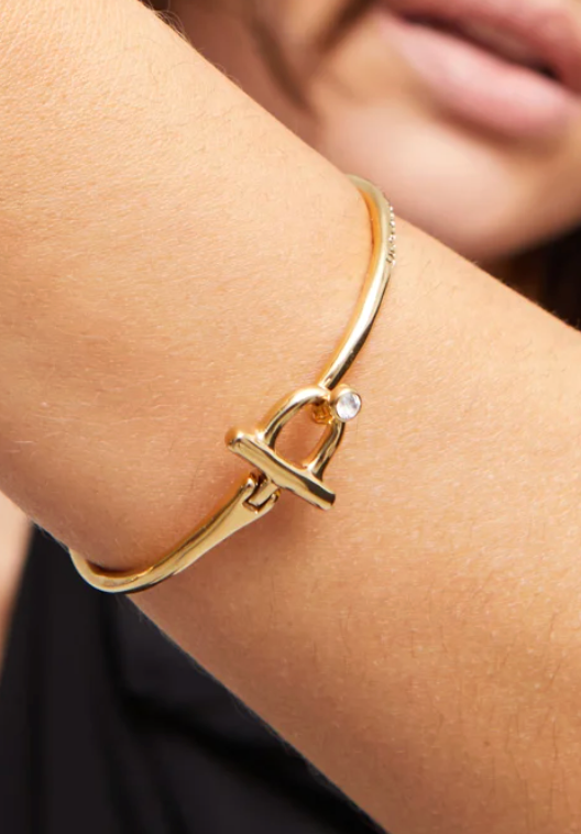 rigid bracelet with front closure of metal alloy plated in gold 18k with white topaz M